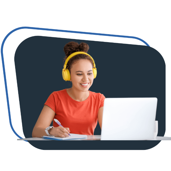 Student learning digital marketing online in Telugu using laptop and taking notes during recorded training session